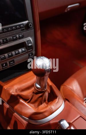 Close-Up of Porsche 911 Manual Gear Shifter in Brown Leather Interior Stock Photo