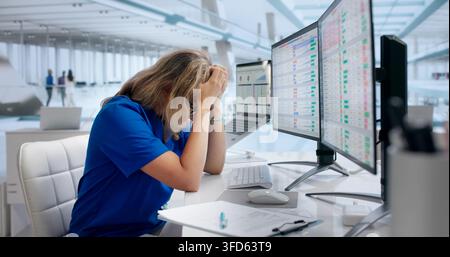 Young Woman Using Laptop, Struggling With Complex Medical Billing Codes. Stock Photo