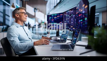 Software Engineer Rapidly Builds Business Apps Using Low Code Platform. Stock Photo