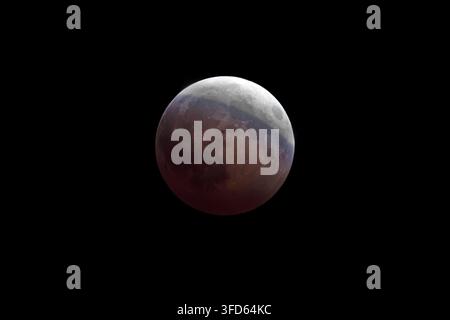 A super-telephoto image of the recent lunar eclipse as seen from the state of Iowa in the late evening Stock Photo