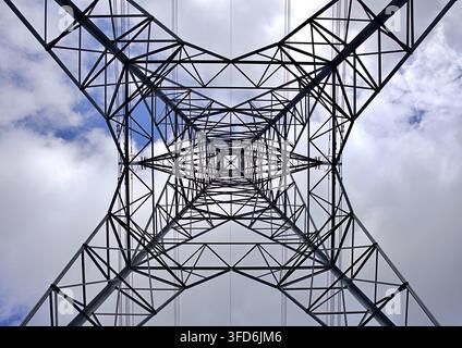 Symmetry of low angle view of an electricity pylon Stock Photo