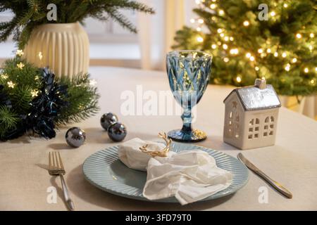 Elegant Christmas place setting with napkin and reindeer ring Stock Photo