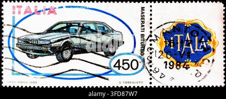 Italian commemorative postage stamp issued in 1984 by Poste Italiane featuring the Maserati Biturbo sports coupe Stock Photo