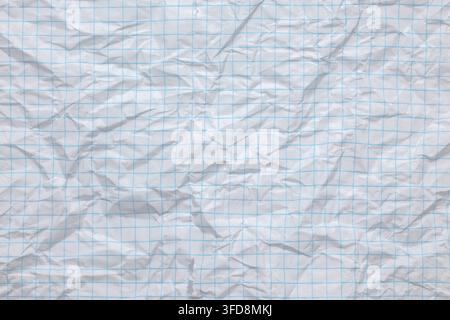 Crumpled white paper with blue grid lines forming a textured background Stock Photo