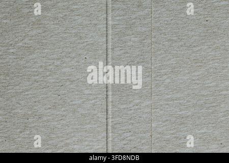 Gray cardboard material presenting a textured surface with subtle lines for backgrounds Stock Photo