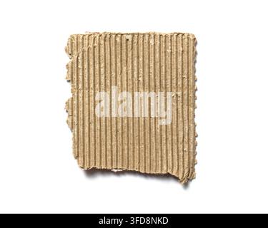 Brown corrugated cardboard scrap with torn edges isolated on a white background Stock Photo