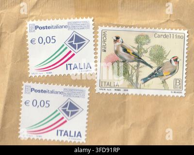 Italian postage stamps set including two 0.05 Euro priority mail issues and 2022 Europa Goldfinch Cardellino issue on paper background Stock Photo