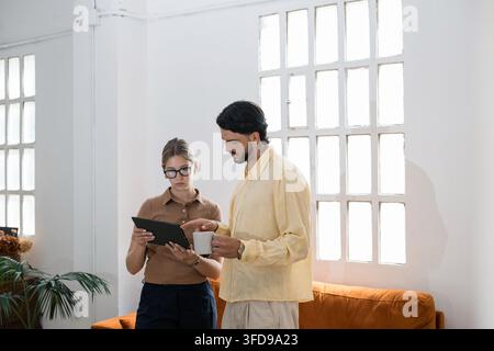 Business colleagues collaborating using digital tablet Stock Photo