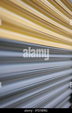 Yellow and Grey Corrugated Metal Roller Shutter Door Minimalist Abstract Texture Stock Photo
