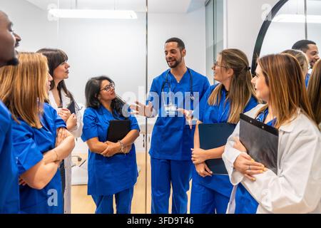 Medical team collaborating and discussing patient care Stock Photo