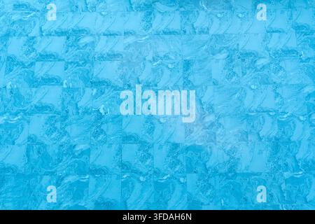 Top view and full frame of blue swimming pool background texture is used as blue water background texture. Stock Photo