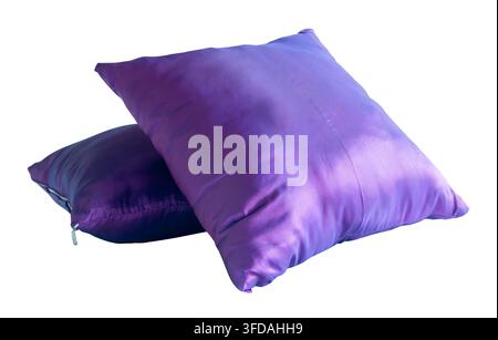 Two purple pillows after use in stack are isolated on white background with clipping path. Stock Photo