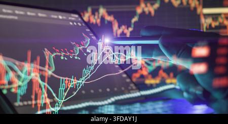 Futuristic financial investment background with a hand touching touchscreen displaying economic data and market trends. Stock Photo