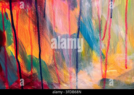 Close up of a colorful abstract acrylic painting on canvas showing orange, pink and teal brushstrokes with vertical dripping paint lines forming a Stock Photo