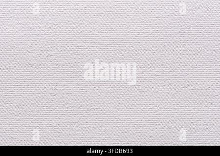 Close up of blank white cotton canvas texture showing the fine woven weave of natural fabric, a soft neutral textile background with copy space for Stock Photo