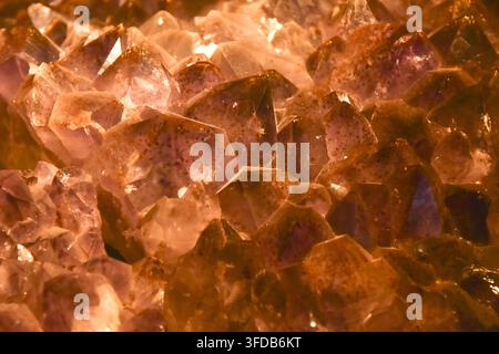 amethyst quartz rock color purple or gold background and texture Stock Photo