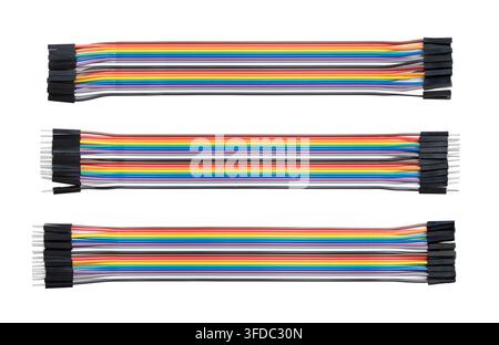 Multicolor jumper wires, rainbow ribbon cable set for breadboards, isolated from above. 20-way jumper cables with standard configuration types. Photo Stock Photo