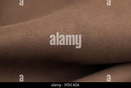 Brown suede fabric texture showing soft folded material with detailed surface Stock Photo