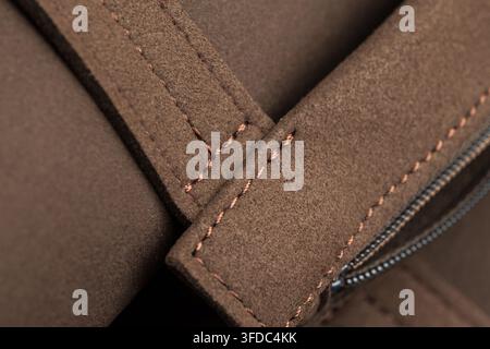 Brown nubuck leather showing detailed stitching and fabric texture Stock Photo