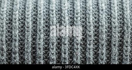 Grey knitted wool fabric showing a close-up texture and pattern Stock Photo