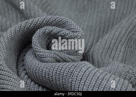 Grey knitted wool fabric showing a soft, warm texture pattern Stock Photo