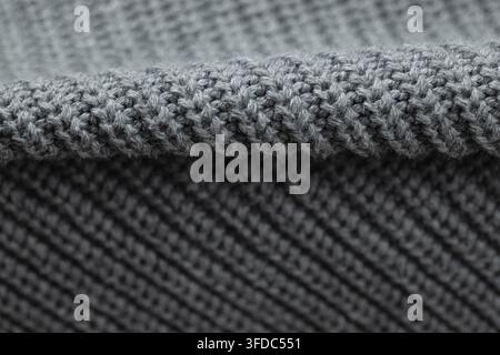Close-up showing grey knitted textile with two different weave patterns Stock Photo