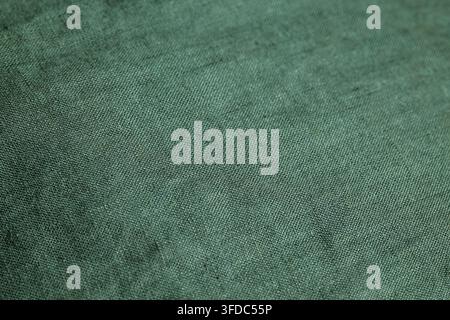 Green woven textile showing natural linen fiber pattern and background Stock Photo