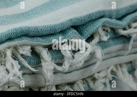 Striped cotton textile with fringe, showing texture and soft fabric Stock Photo