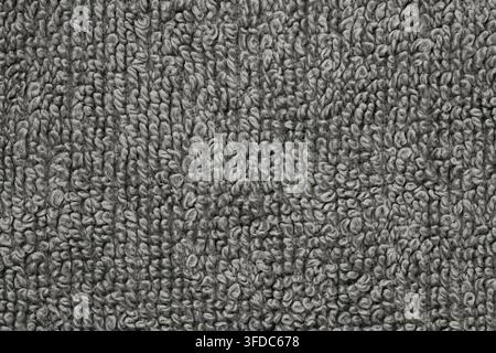 Gray terry cloth textile shows a soft, absorbent loop pile fabric texture Stock Photo