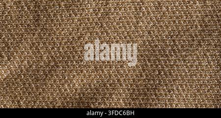 Beige wool knit fabric showing a detailed textile texture and pattern Stock Photo
