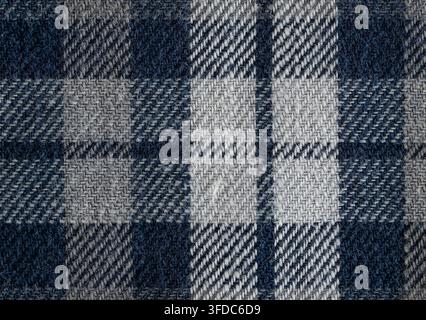 Blue and gray woven plaid fabric providing a textured background Stock Photo