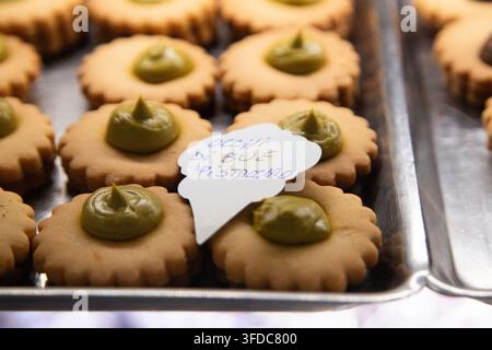 Assortment of Sicilian cookies featuring almond and pistachio paste, chocolate, and local Italian products. Stock Photo