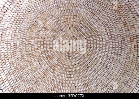 Macro view looking up into an intricate circular concentric brickwork ceiling dome in Hammat-al-Jarid. Photographed on 8.10.2024 Stock Photo