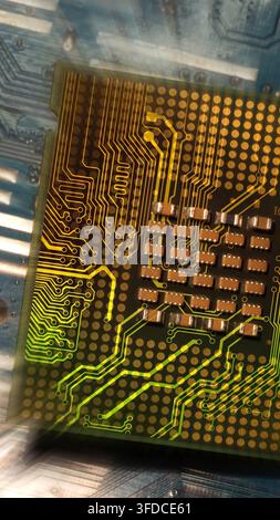 Conceptual high-tech computing hardware background with glowing gold data tracks on CPU Stock Photo