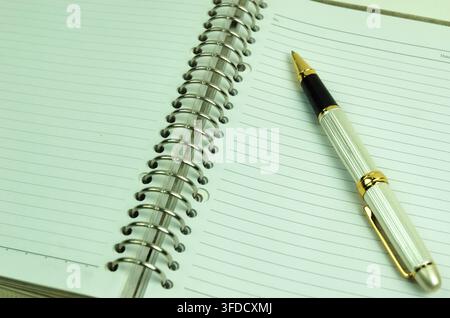 close up of spiral notebook and pen as a reminder concept Stock Photo