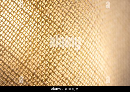 Beige woven mesh fabric in macro close view for textile texture background craft design or natural material backdrop Stock Photo