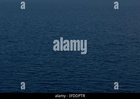 Calm dark blue ocean surface with gentle ripples and texture Stock Photo
