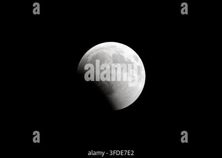 A super-telephoto image of the recent lunar eclipse as seen from the state of Iowa in the late evening Stock Photo