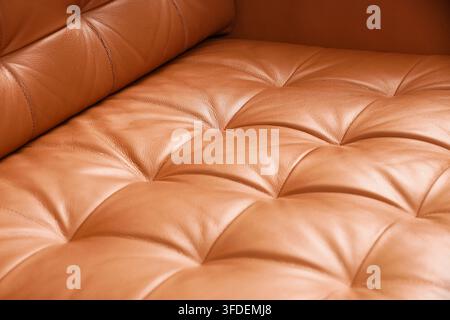 Luxury interior design and comfort, brown leather sofa texture with tufted upholstery and soft cushions for home decor or high-end furniture catalog Stock Photo