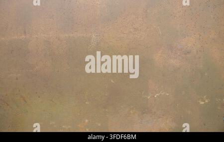 Abstract weathered rusty metal texture featuring aged industrial surface with natural oxidation. High-resolution background suitable for design, overl Stock Photo