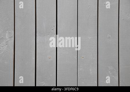 Gray painted wooden plank wall with vertical boards creating a clean rustic texture. High-resolution wooden background for design, architecture and gr Stock Photo