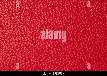 Macro background texture of bright red pebbled genuine leather material Stock Photo
