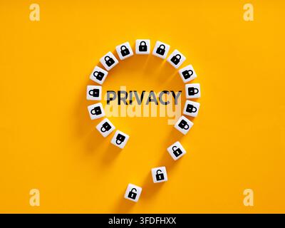 Privacy word written on yellow background with padlocks, some open, representing data vulnerability and security breach risks Stock Photo