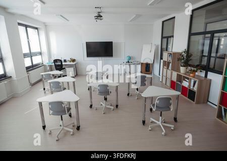 Empty modern primary school classroom ready for students. Stock Photo