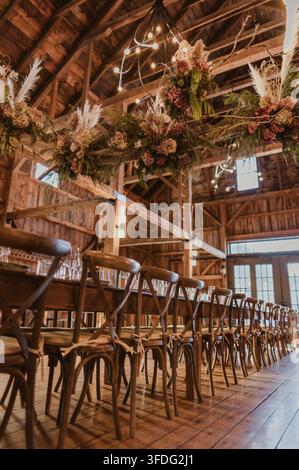 Rustic barn wedding reception table and decor Stock Photo