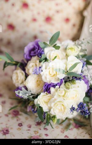 Beautiful bridal bouquet with white roses and lavender Stock Photo