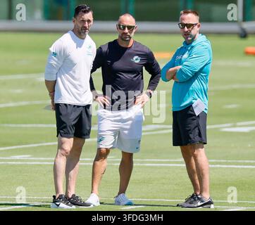Miami Dolphins assistant general manager Kyle Smith, general manager Jon-Eric Sullivan and head coach Jeff Hafley stand on the field during the first day of rookie minicamp in Miami on May 8, 2026. The three members of the Dolphins' new front office and coaching leadership gathered as the team began its first rookie minicamp session of the 2026 offseason. (Photo by Al Diaz/Miami Herald/TNS/Sipa USA) Stock Photo