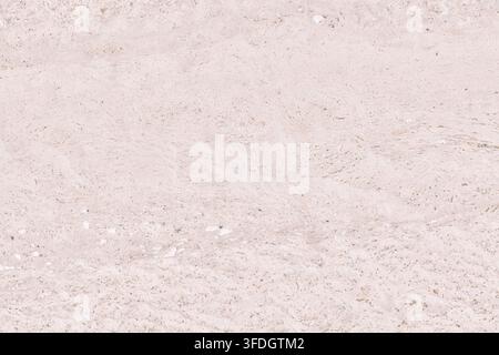 Close up background texture of light beige travertine limestone stone surface with natural pores and subtle mineral veins. Ideal for background design Stock Photo