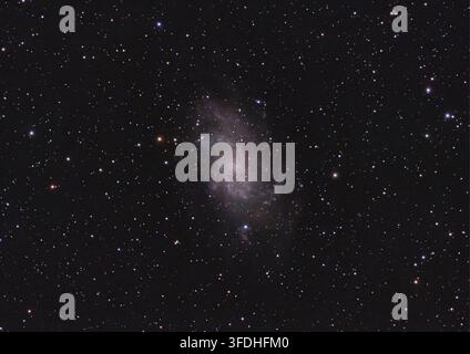 The Triangulum Galaxy, also known as M33, is a spiral galaxy of the type SA(s)cd located about 3 million light-years from Earth. Stock Photo