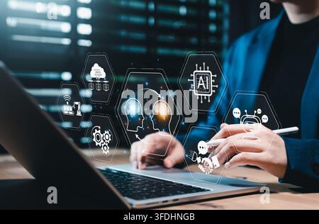 Human and AI Knowledge Transfer and Collaboration Concept. Person using laptop with icons showing human brain and AI brain, symbolizing artificial int Stock Photo